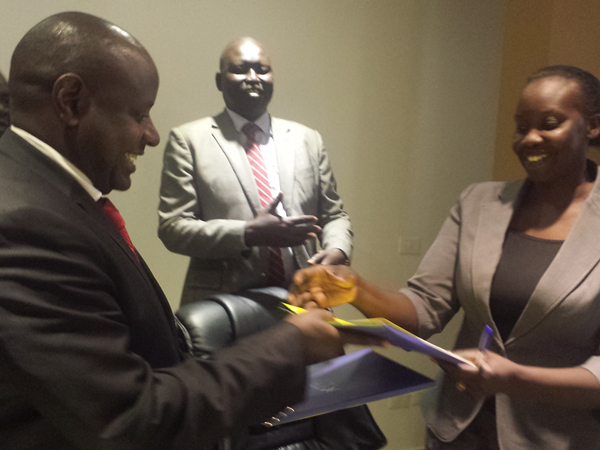 Left: TMA Country Director John Bosco shakes hands with Aja Kuol, the Acting Chairperson for the Chamber of Women Entrepreneurs after signing the USD 400 million deal yesterday.  Looking on is South Sudan Ministry of Finance and Economic Planning Undersecretary Hon. Wani Buyu Dyori.