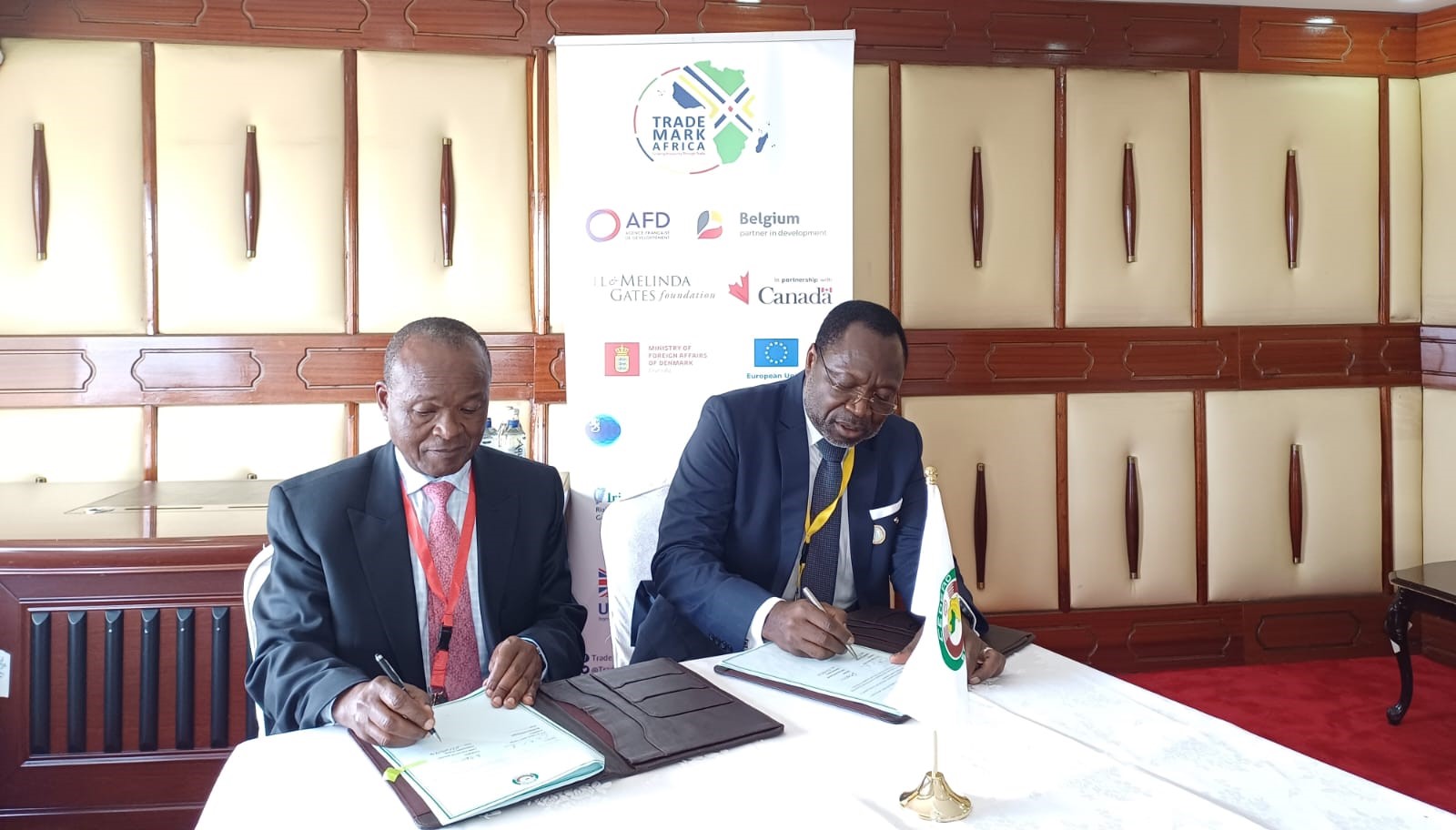 Dr. Omar Alieu Touray, President of the ECOWAS Commission, and Amb. Erastus Mwencha, Chairman of the TradeMark Africa Board, shake hands following the signing of an agreement. This partnership will see ECOWAS and TradeMark Africa jointly pursue trade facilitation initiatives and promote economic prosperity across West Africa