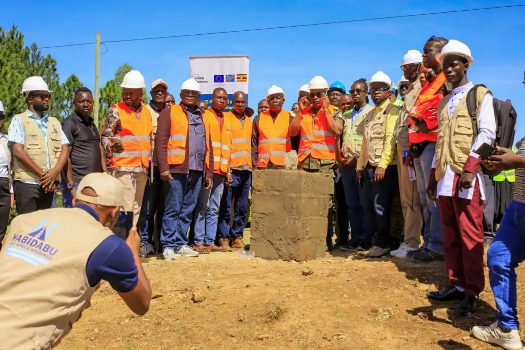 Partners gather at the foundation stone of the new EU-funded bridge at Mahagi-Goli